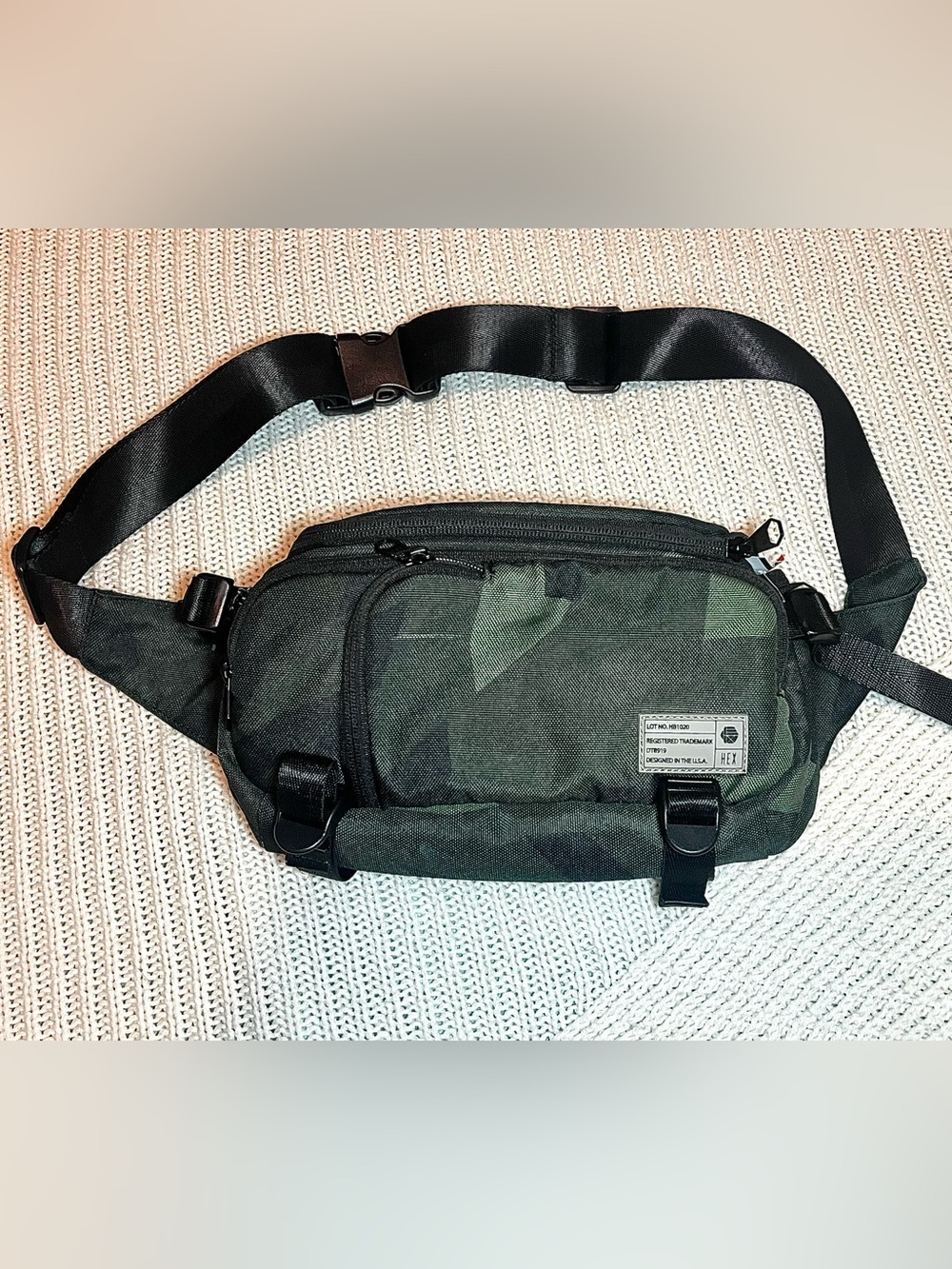 Hex Ranger DSLR Mini Sling Camera Bag in a green woodland camo pattern